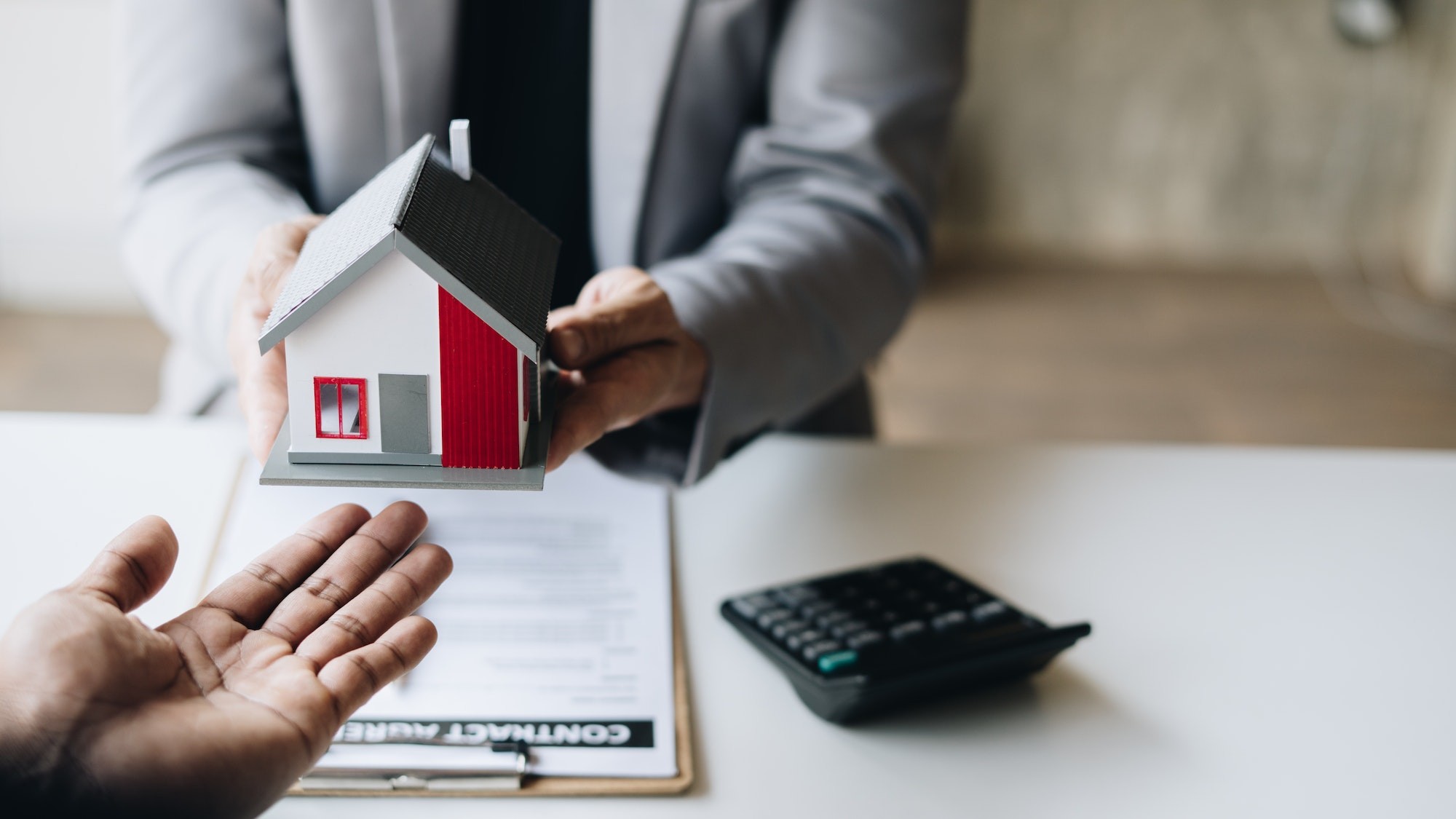 Real estate agent talked about the terms of the home purchase agreement.